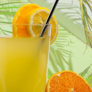 orange juice in clear drinking glass
